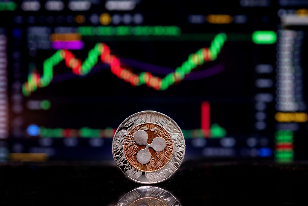 Metacade in bilico, XRP guida i mega cap delle criptovalute